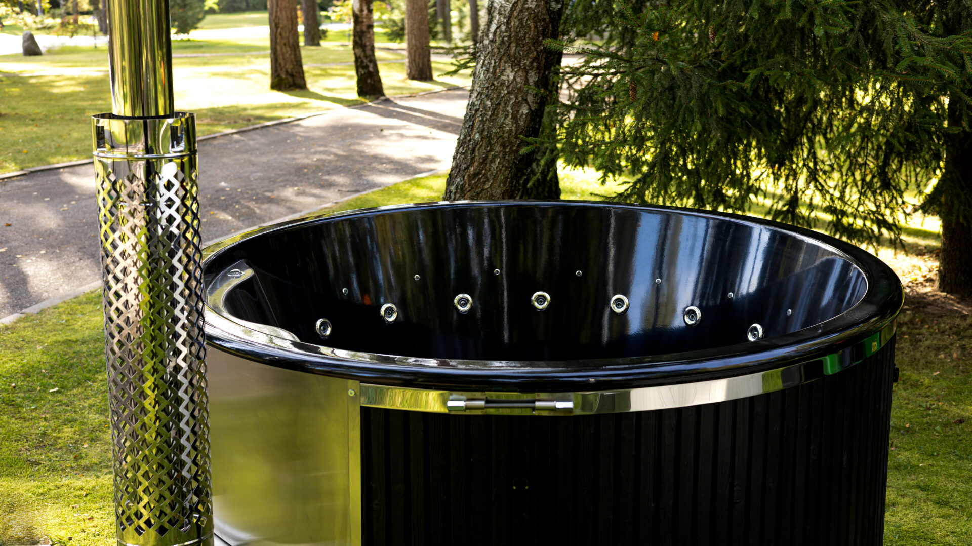 Benas hot tub by Celsium set within a calm forest landscape