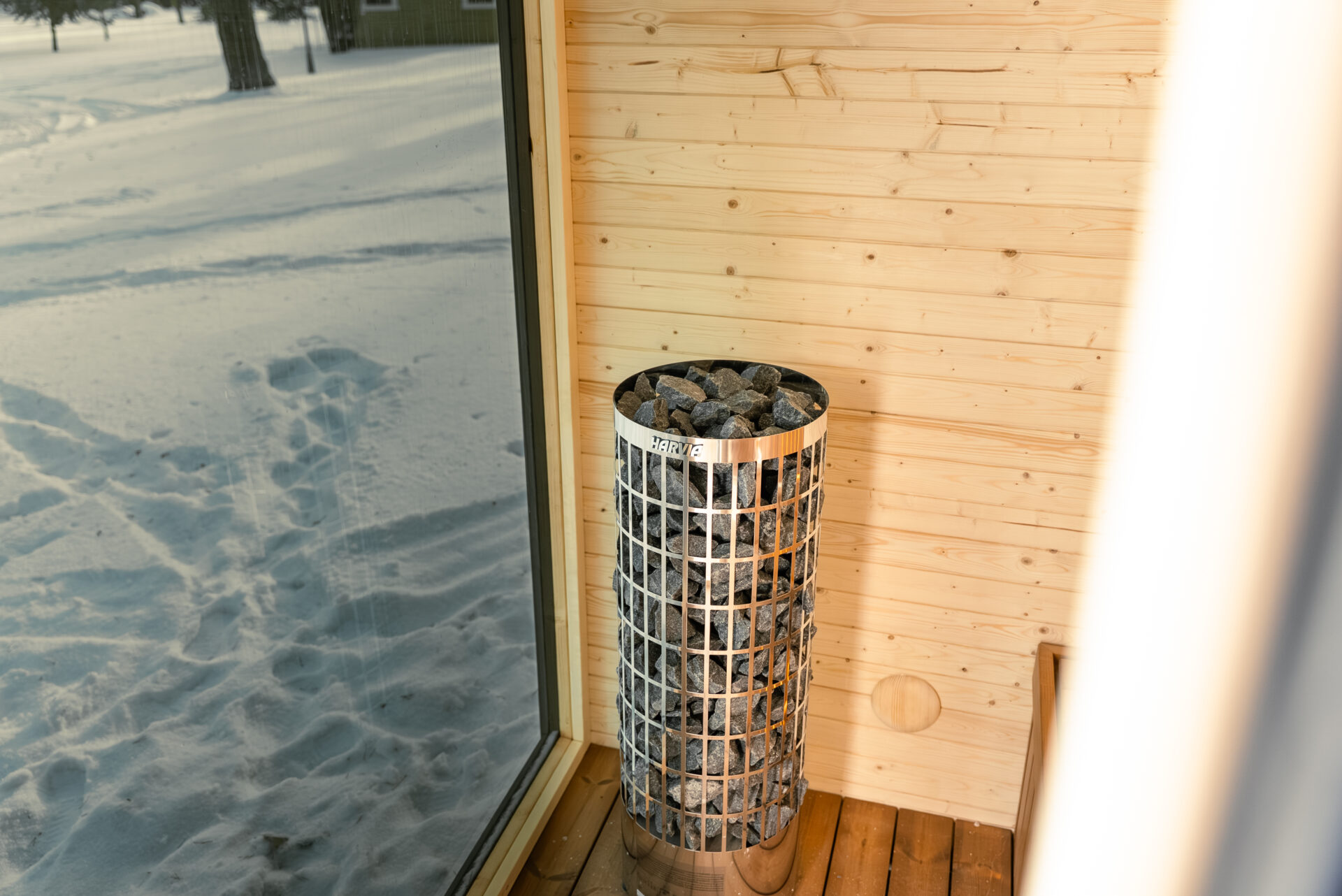 Quite modular sauna resting in a winter forest, designed for slow outdoor wellness